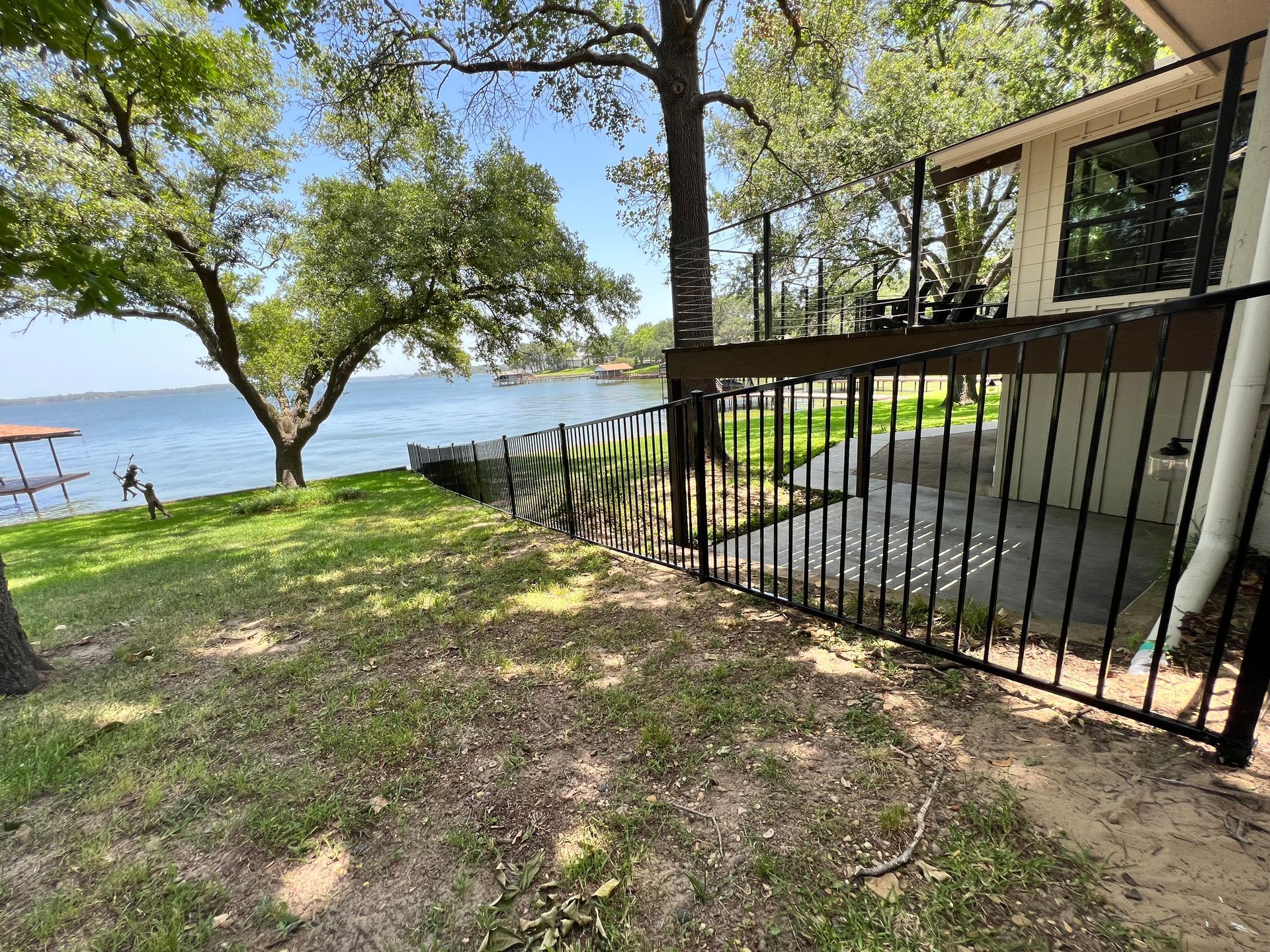 A house with a balcony overlooking a lake.