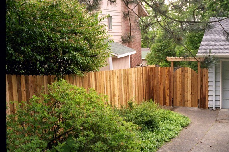 Deck Installation — Man fixing the Wood Fence in Portland, OR