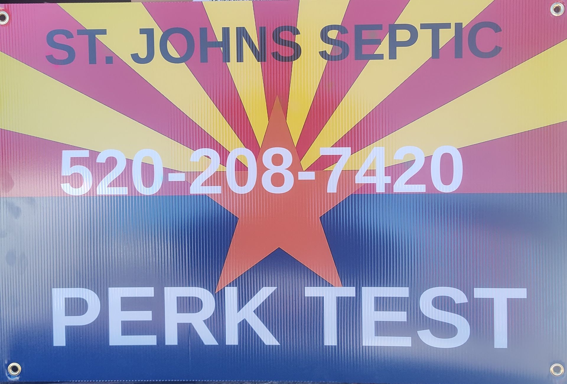 St. Johns Septic sign with Arizona flag colors, phone number 520-208-7420, and “PERK TEST” text