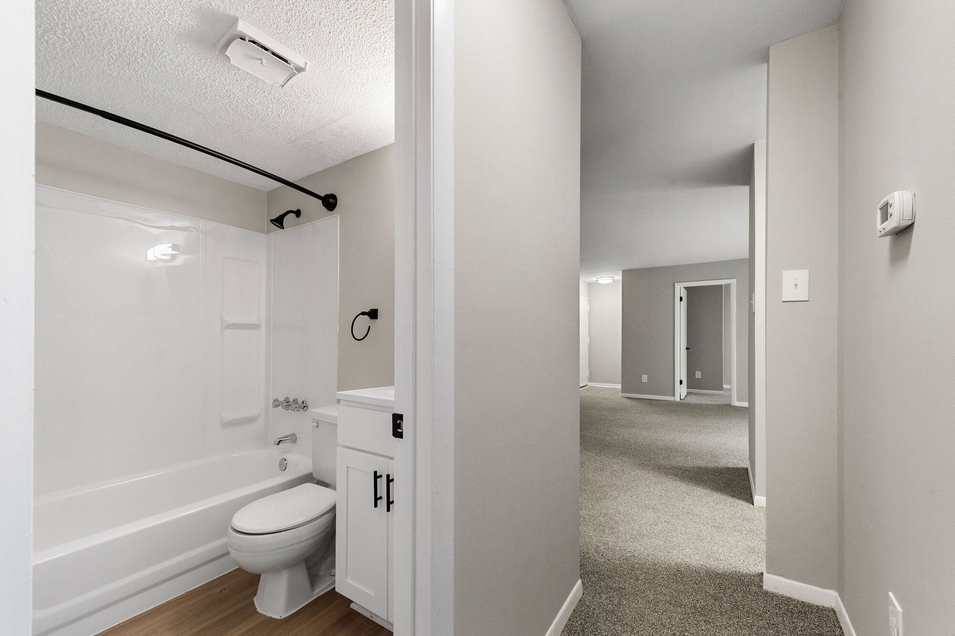 Bathroom in an apartment unit with a tub/shower, toilet, and vanity at The Ridge Apartments in Hagerstown, MD