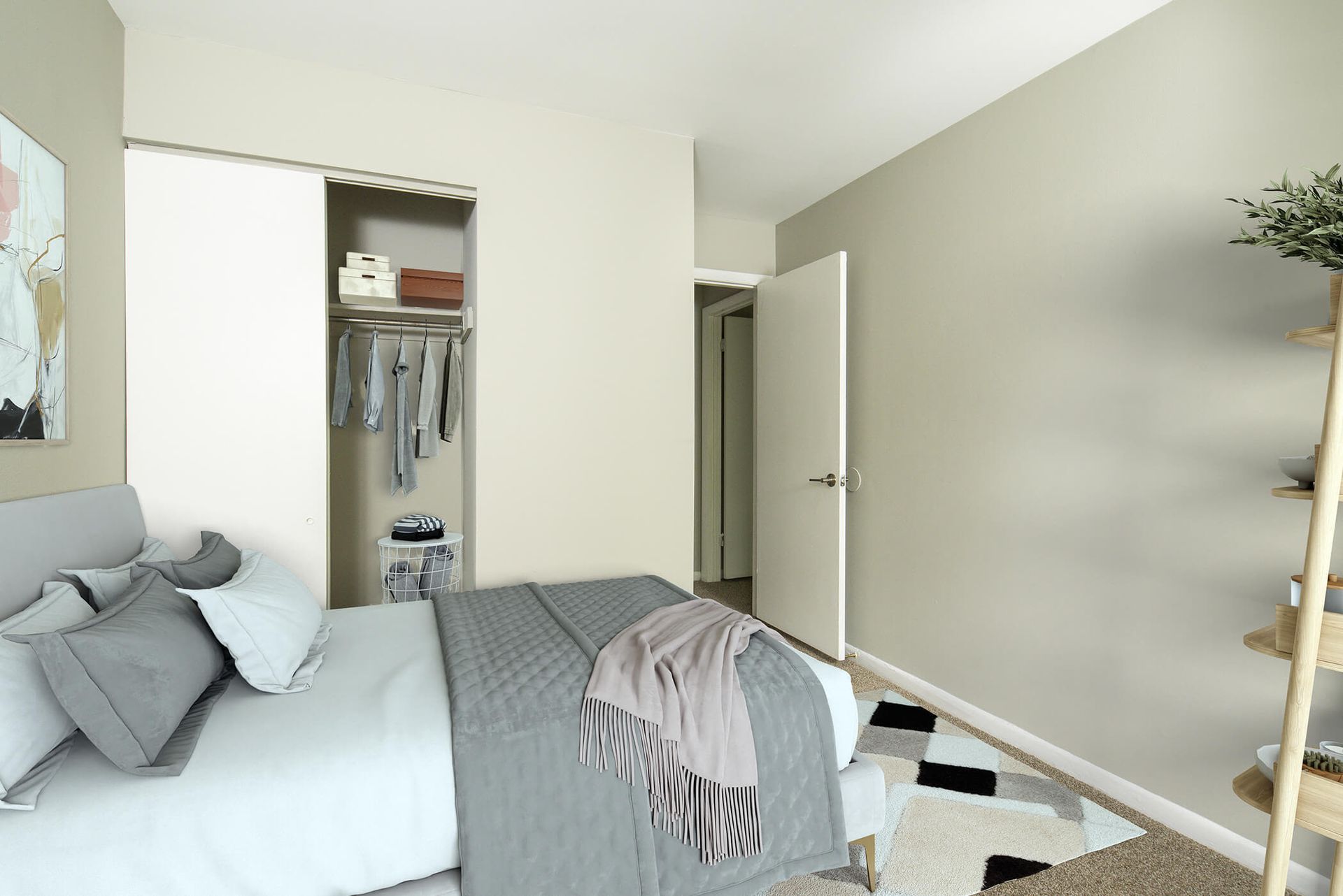 Bedroom with a neatly made bed, open closet, and neutral-toned walls at The Ridge Apartments in Hagerstown, MD