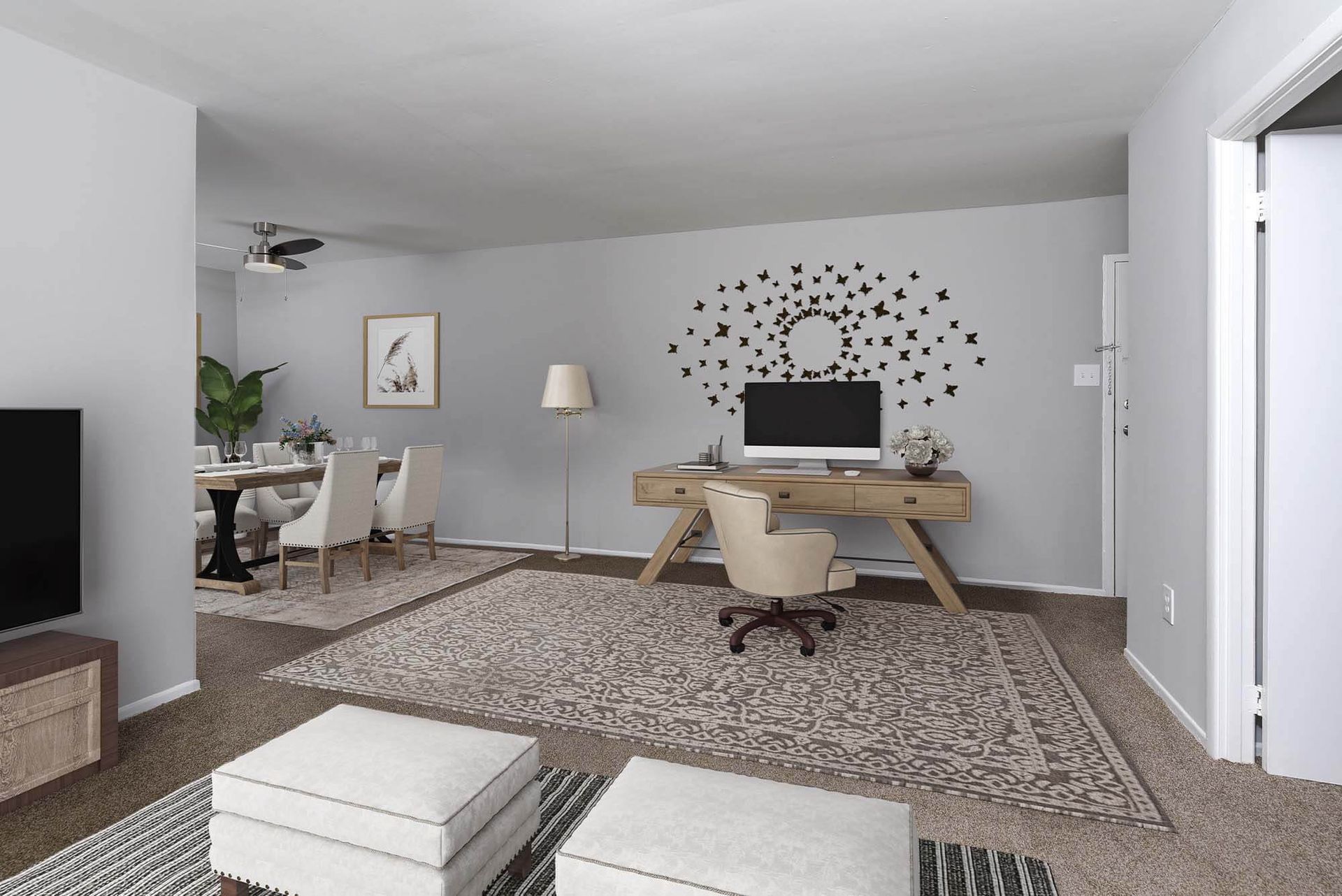 Interior living area with a desk, computer, dining nook, and neutral decor at The Ridge Apartments in Hagerstown, MD