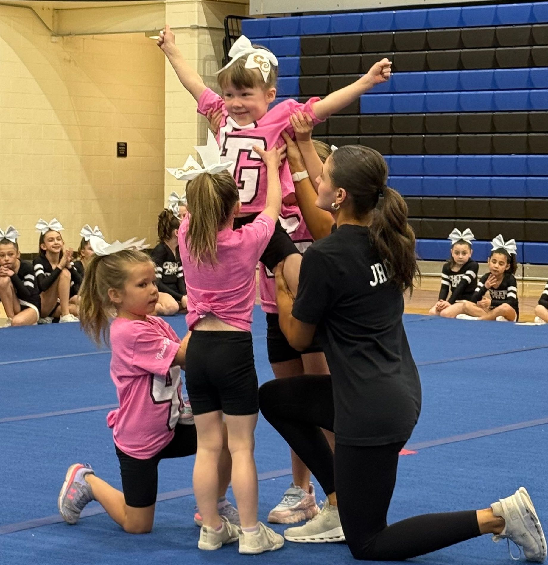 A cheerleader with the number 5 on her shirt