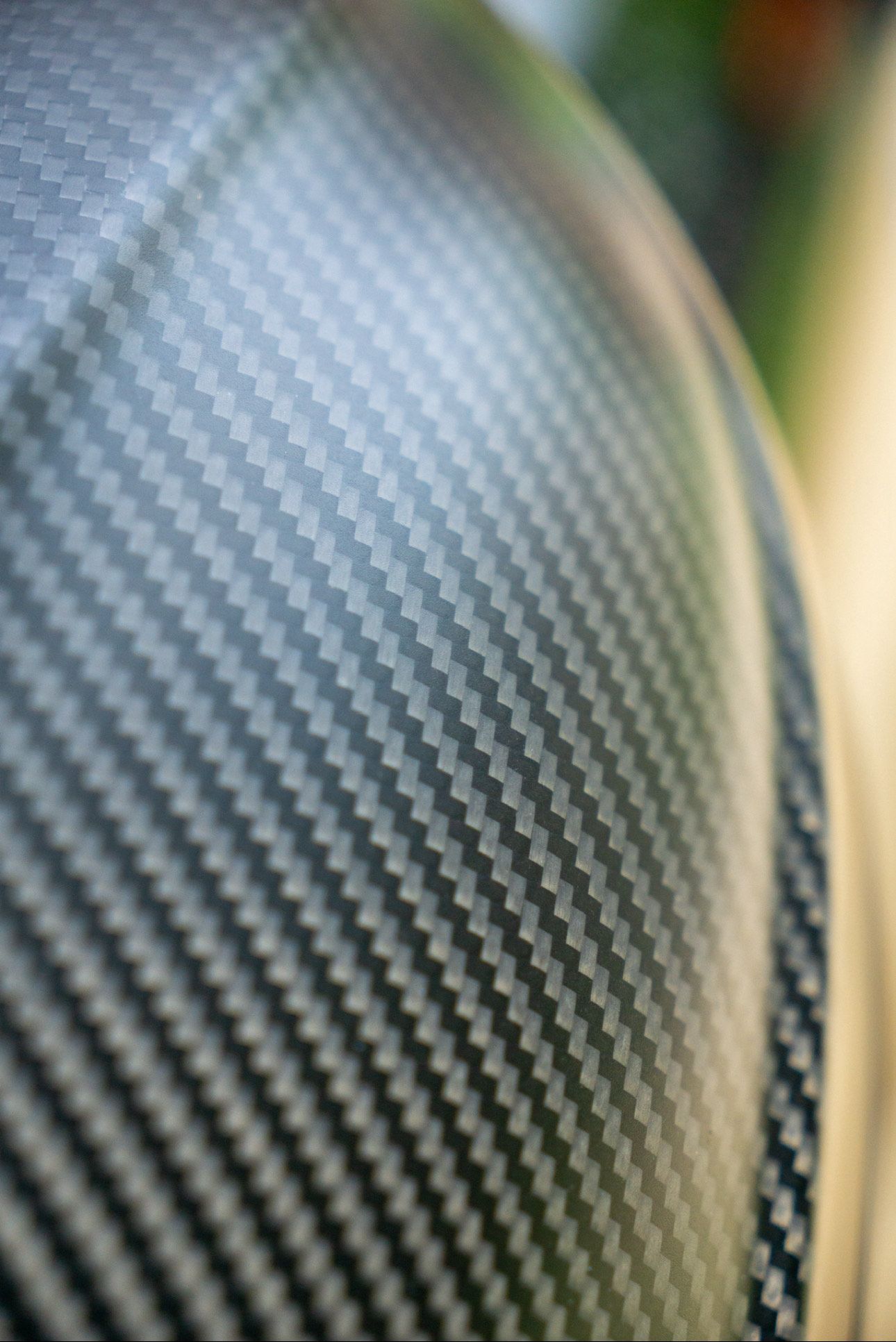A close up of a piece of carbon fiber.