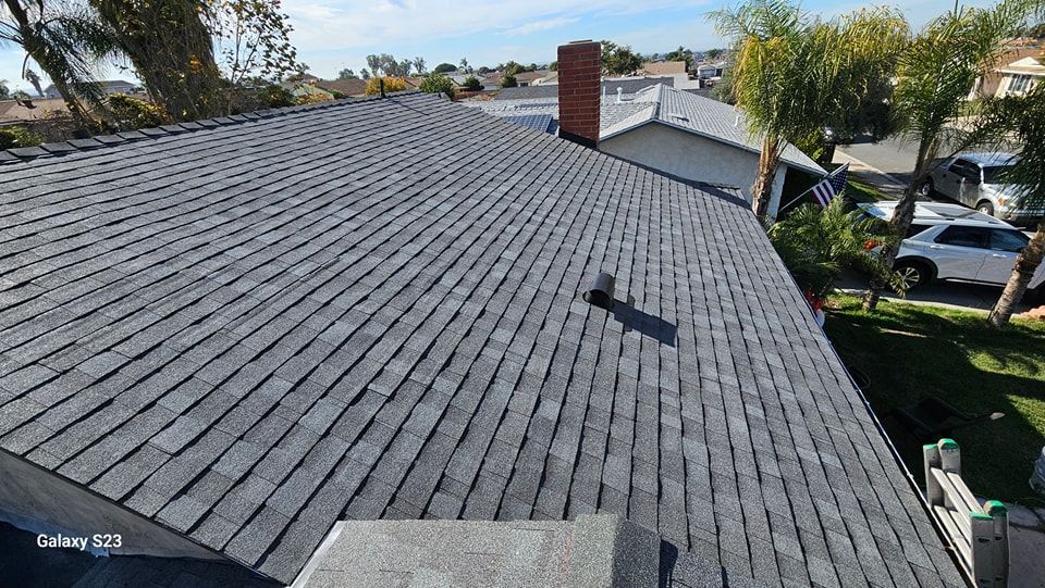 A wooden fence is sitting on top of a lush green field.