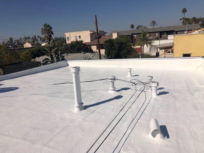 A wooden fence is sitting in the middle of a grassy field.