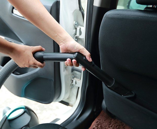 Vacuum Cleaning Car Interior — Oklahoma City, OK — Super Clean Full Service Car Wash And Detail Shop