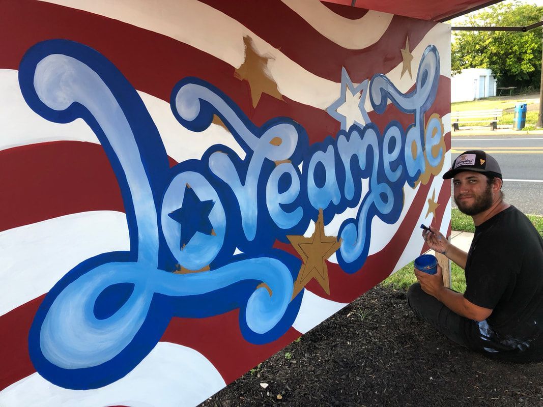 A bunch of incense sticks are sitting on top of each other on a table.