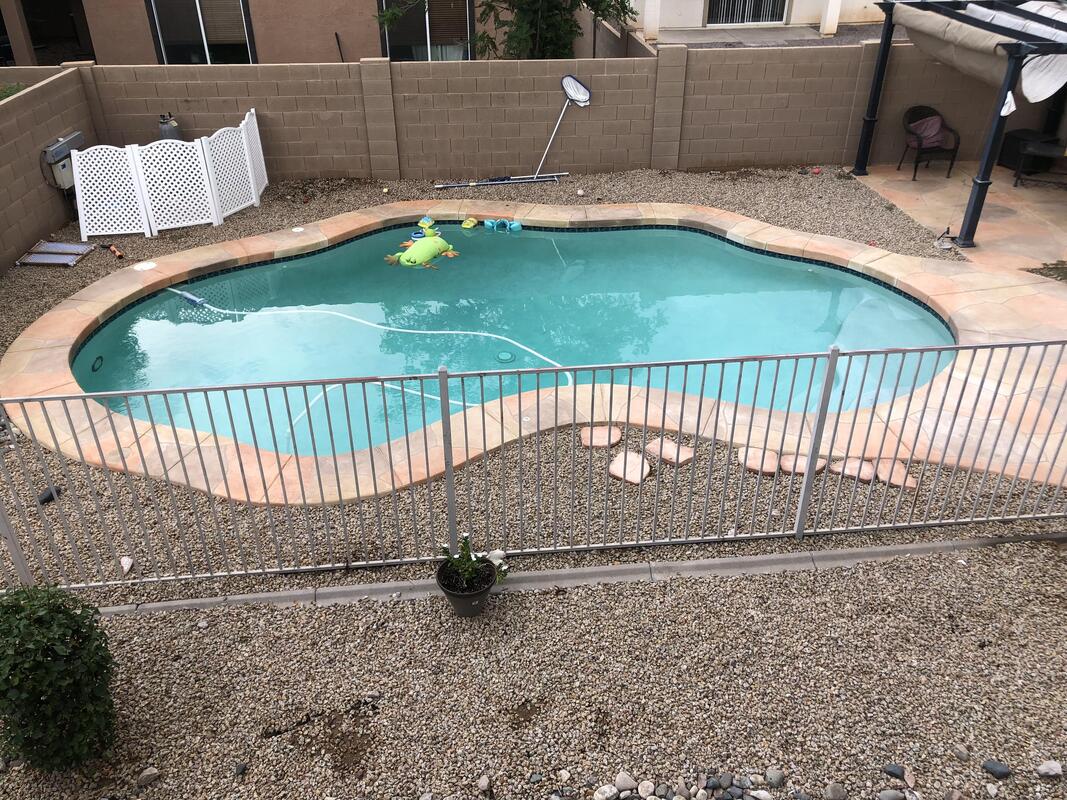 an after picture of a pool in chandler arizona after being cleaned