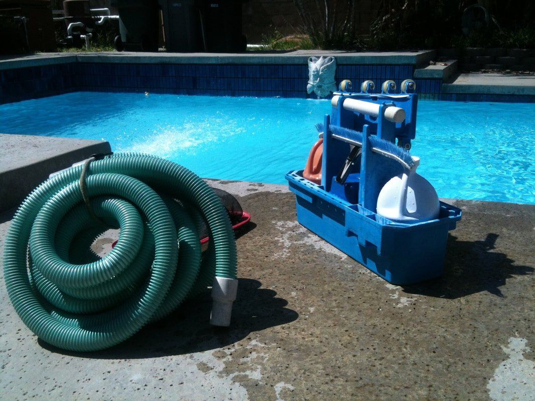 pool cleaning and maintenance supplies next to a sparkling pool in chandler