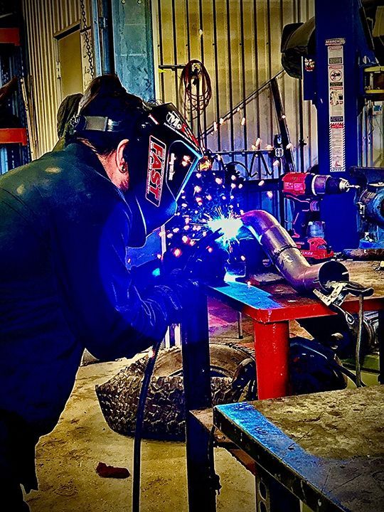 welding metal in a garage