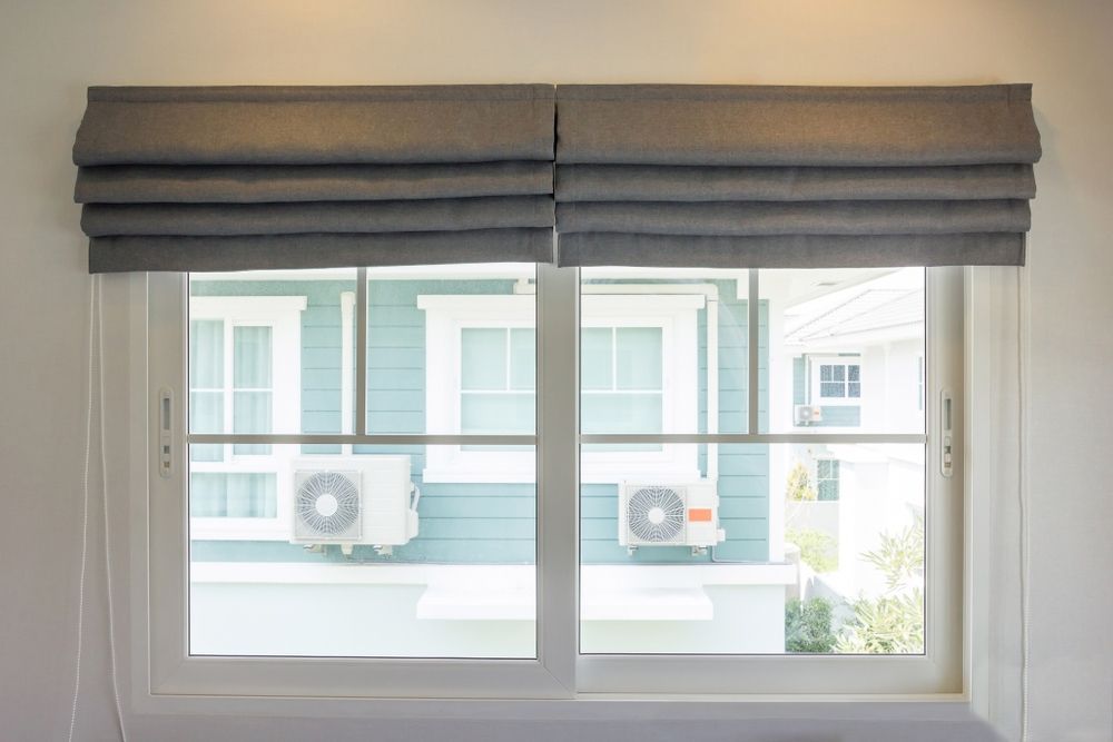 Stylish Grey Roman Blinds for Added Elegance — Blinds in Bogangar, NSW