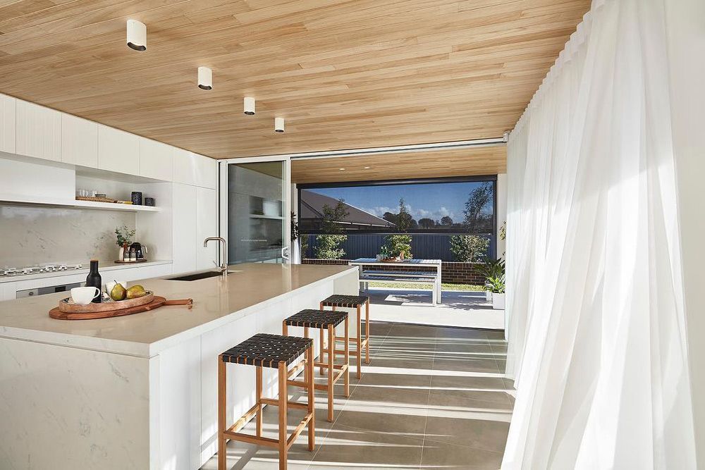 A Bright Kitchen With White Curtain