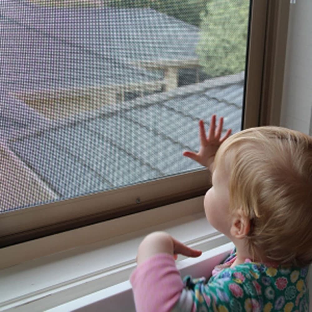 Child Safely Exploring Window with Tweed Coast Security & Blinds — Blinds in Bogangar, NSW