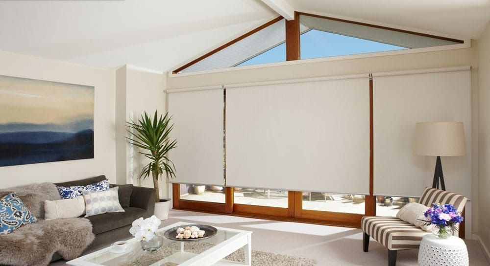 A living room with a couch , chair and table — Blinds in Bogangar, NSW