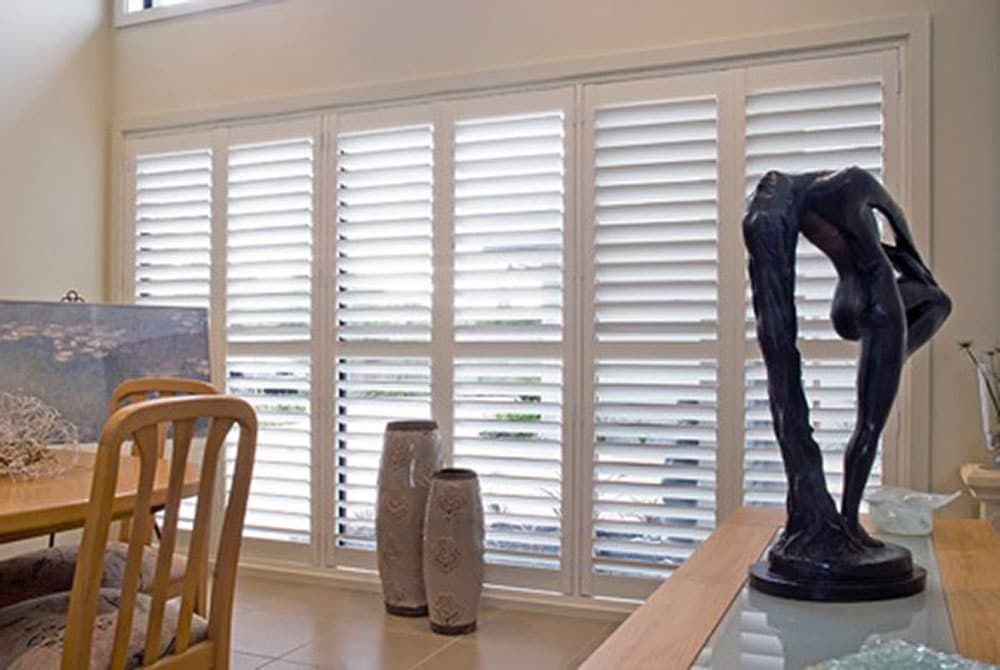 White Shutters Enhance Dining Area — Blinds in Bogangar, NSW