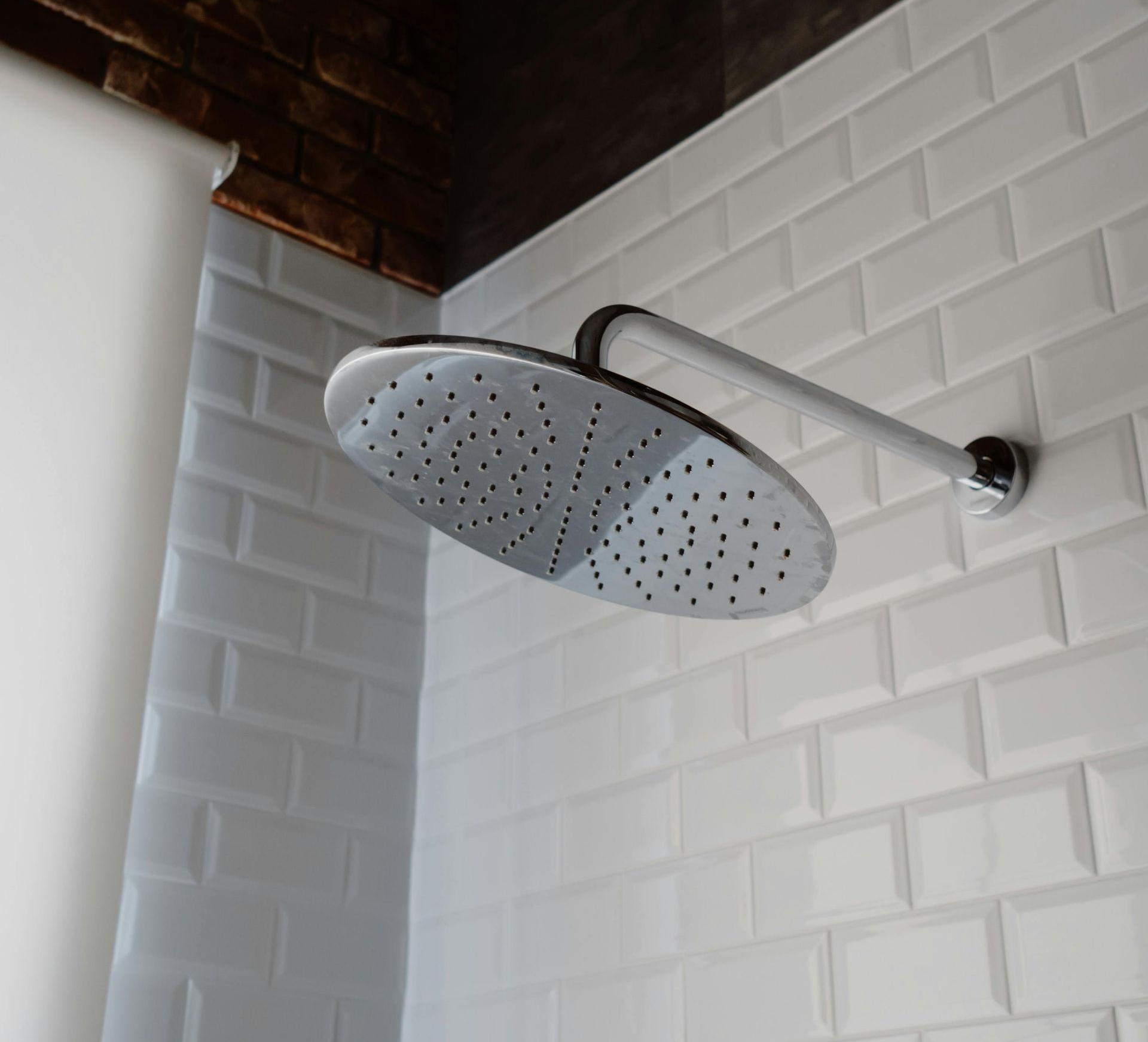 An experienced handyman repairing a ceiling fan, carefully examining the wiring and components for any issues.