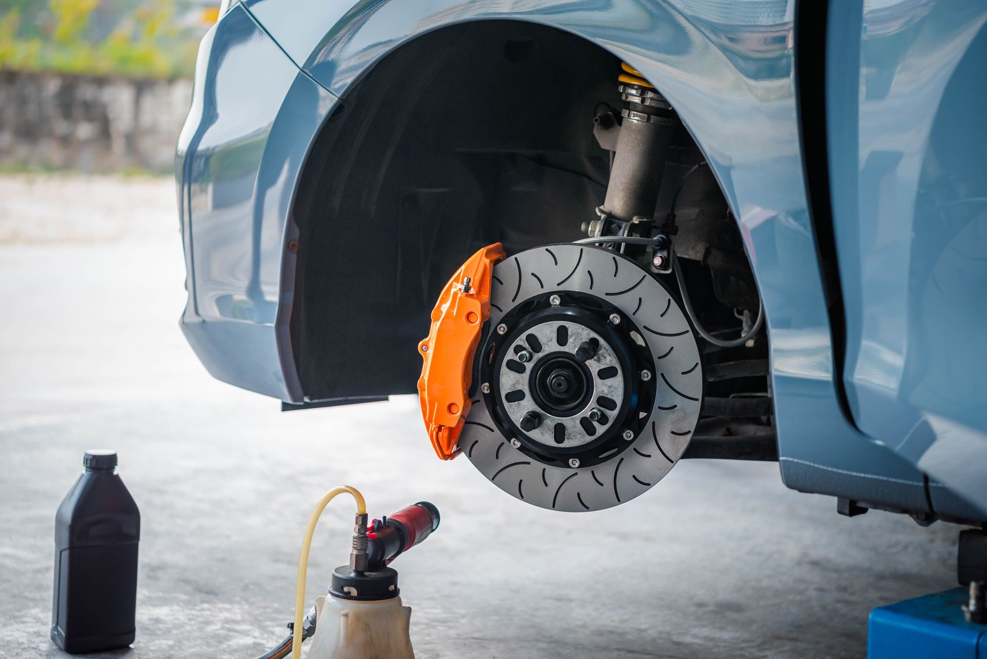A Close Up of a Car 's Brake Disc Being Changed
