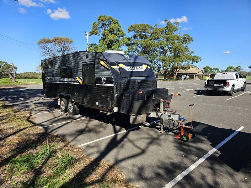A Black Caravan With The Word Eclipse On The Side — A Weigh In - Mobile Weighing Solutions in Noraville, NSW