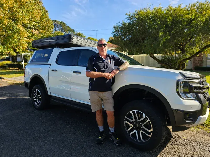 Man Leaning On The White Truck — A Weigh In - Mobile Weighing Solutions in Noraville, NSW