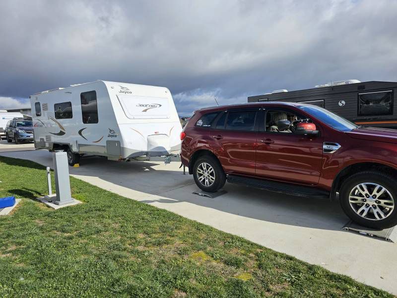 A Red SUV And White Caravan — A Weigh In - Mobile Weighing Solutions in Noraville, NSW