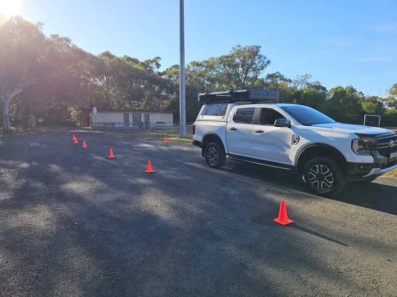 White Truck Parked With Orange Cones On Its Side — A Weigh In - Mobile Weighing Solutions in Noraville, NSW