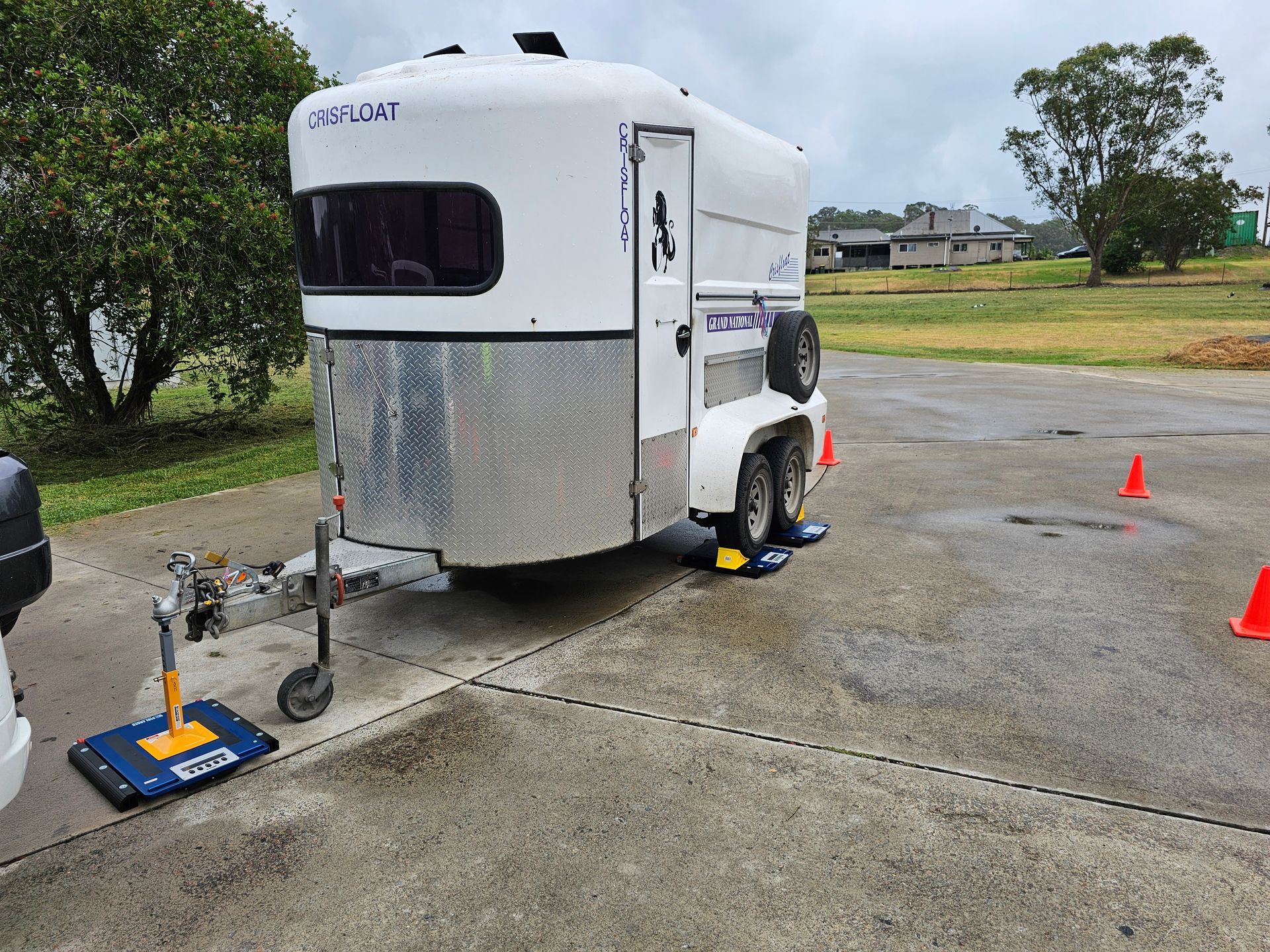 A Horse Is Being Loaded Into a White Trailer — A Weigh In - Mobile Weighing Solutions in Noraville, NSW