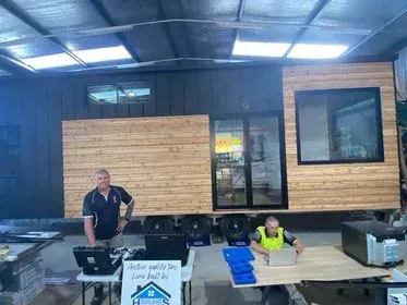 2 People Using Laptop — A Weigh In - Mobile Weighing Solutions in Noraville, NSW