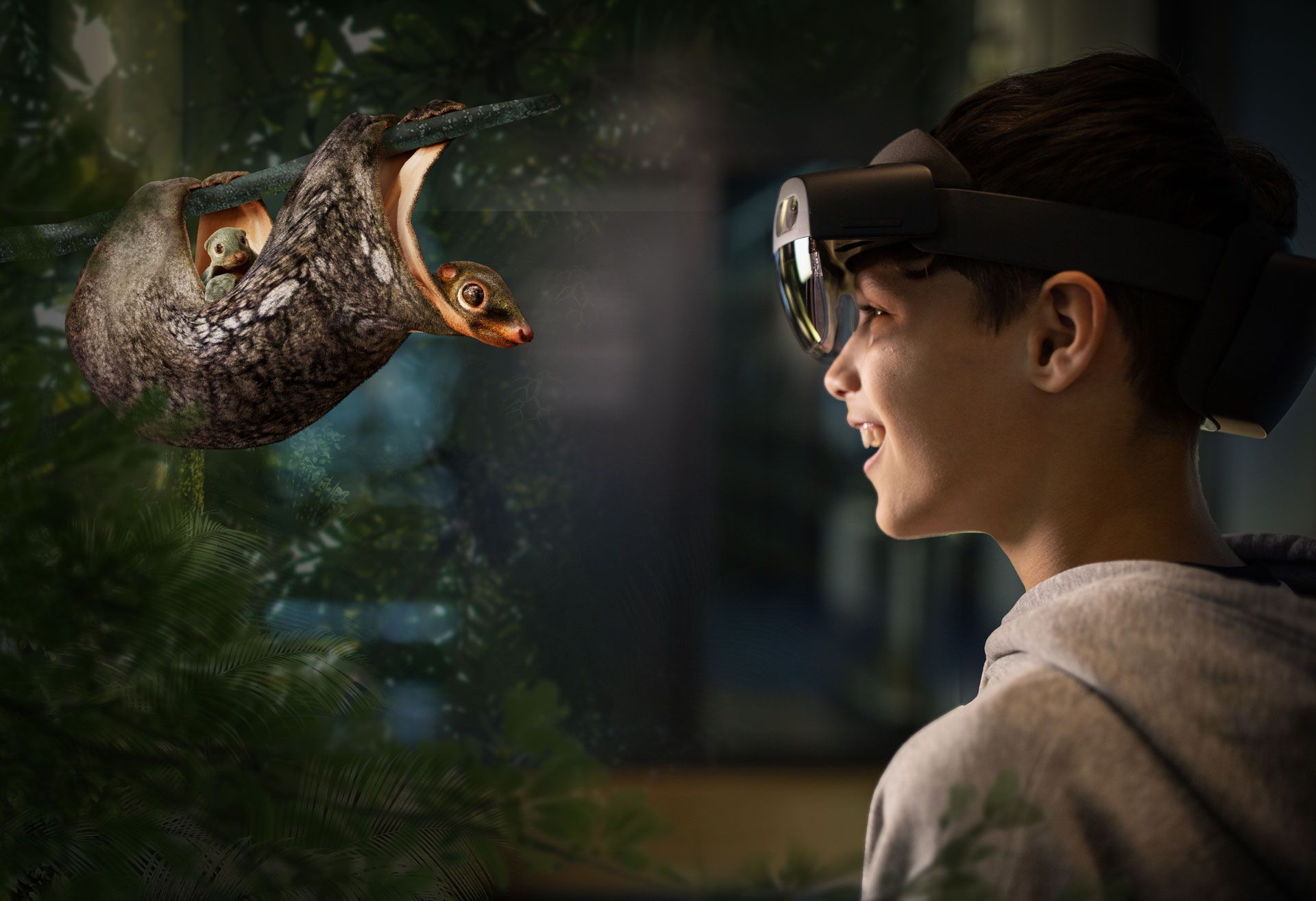 Un jeune garçon portant un casque de réalité virtuelle regarde un colugo.
