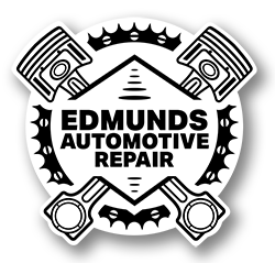 A black and white logo for edmunds automotive repair with pistons and a crown.