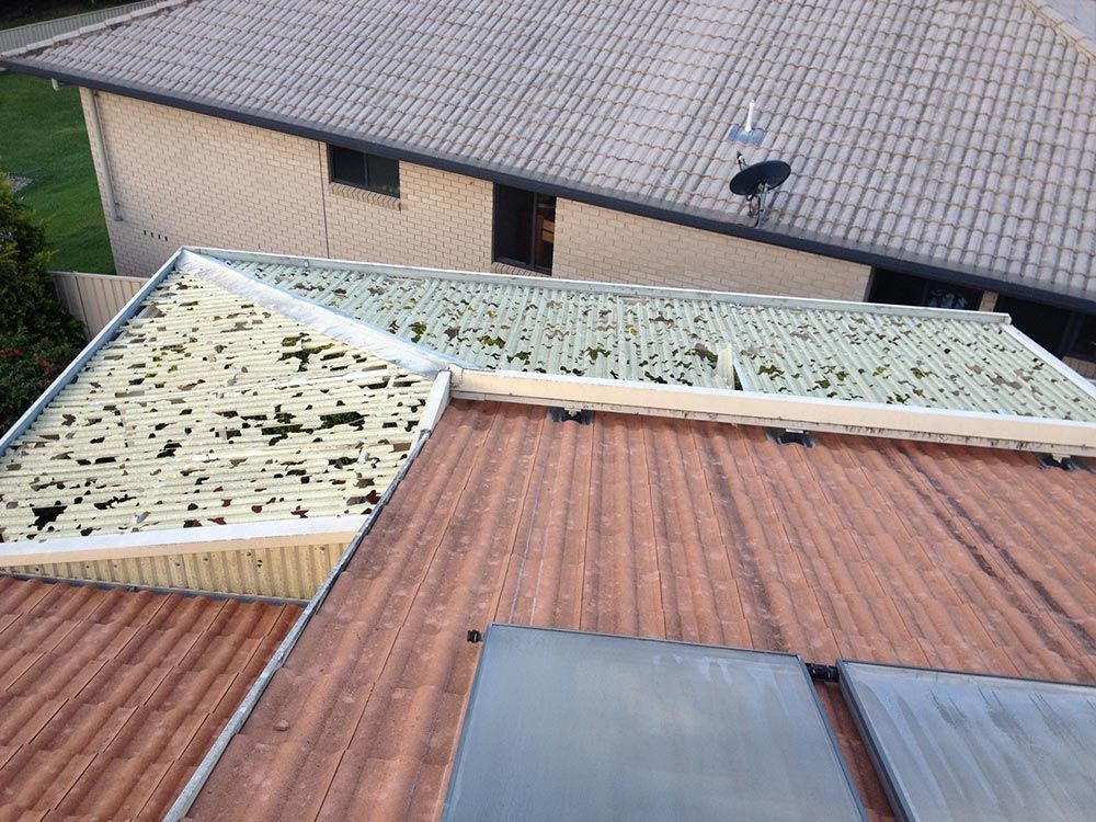 An Aerial View Of A Roof With Two Solar Panels On It — Coffs Coast Building Pty Ltd in Toormina, NSW