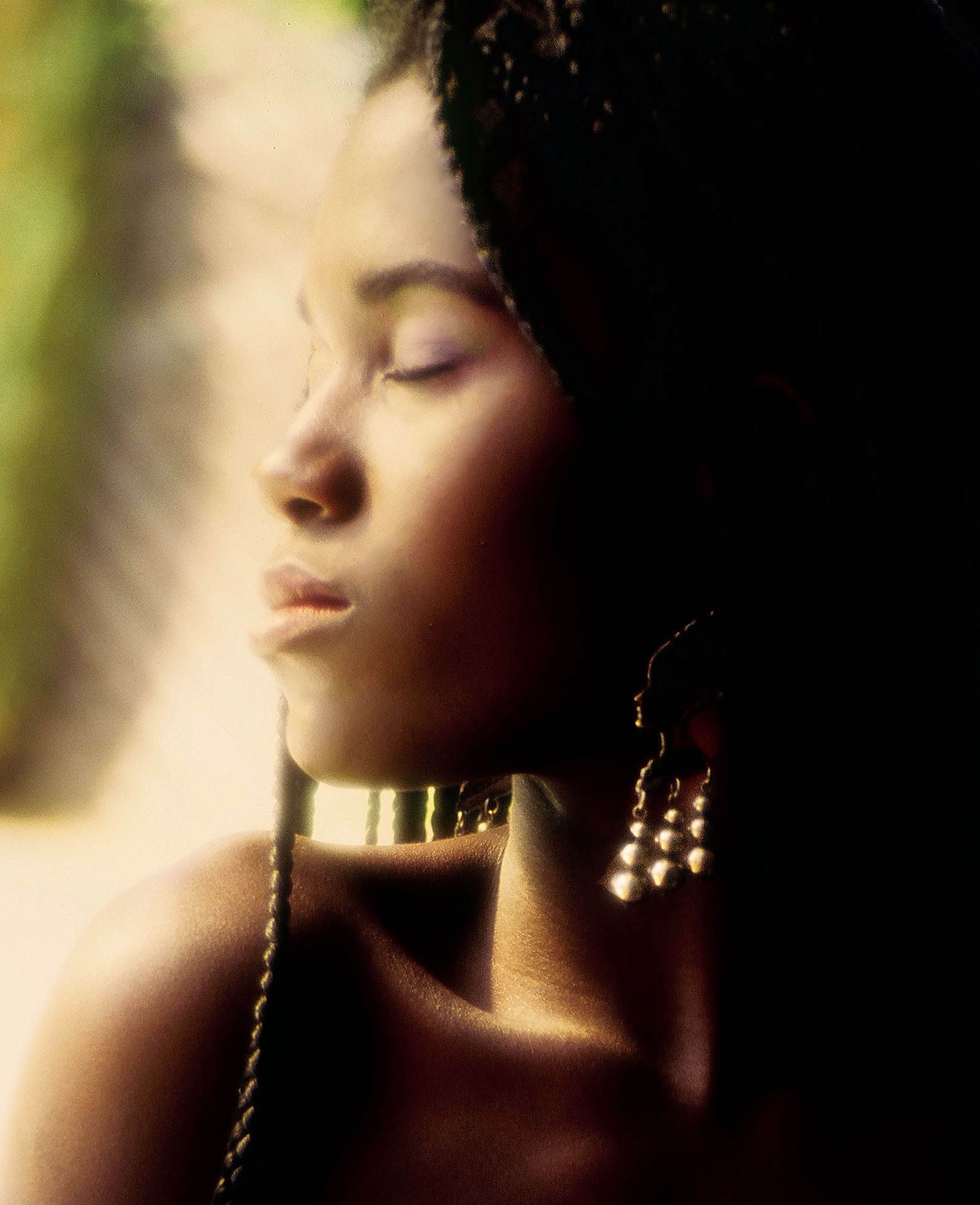 a close up of a woman 's face with her eyes closed