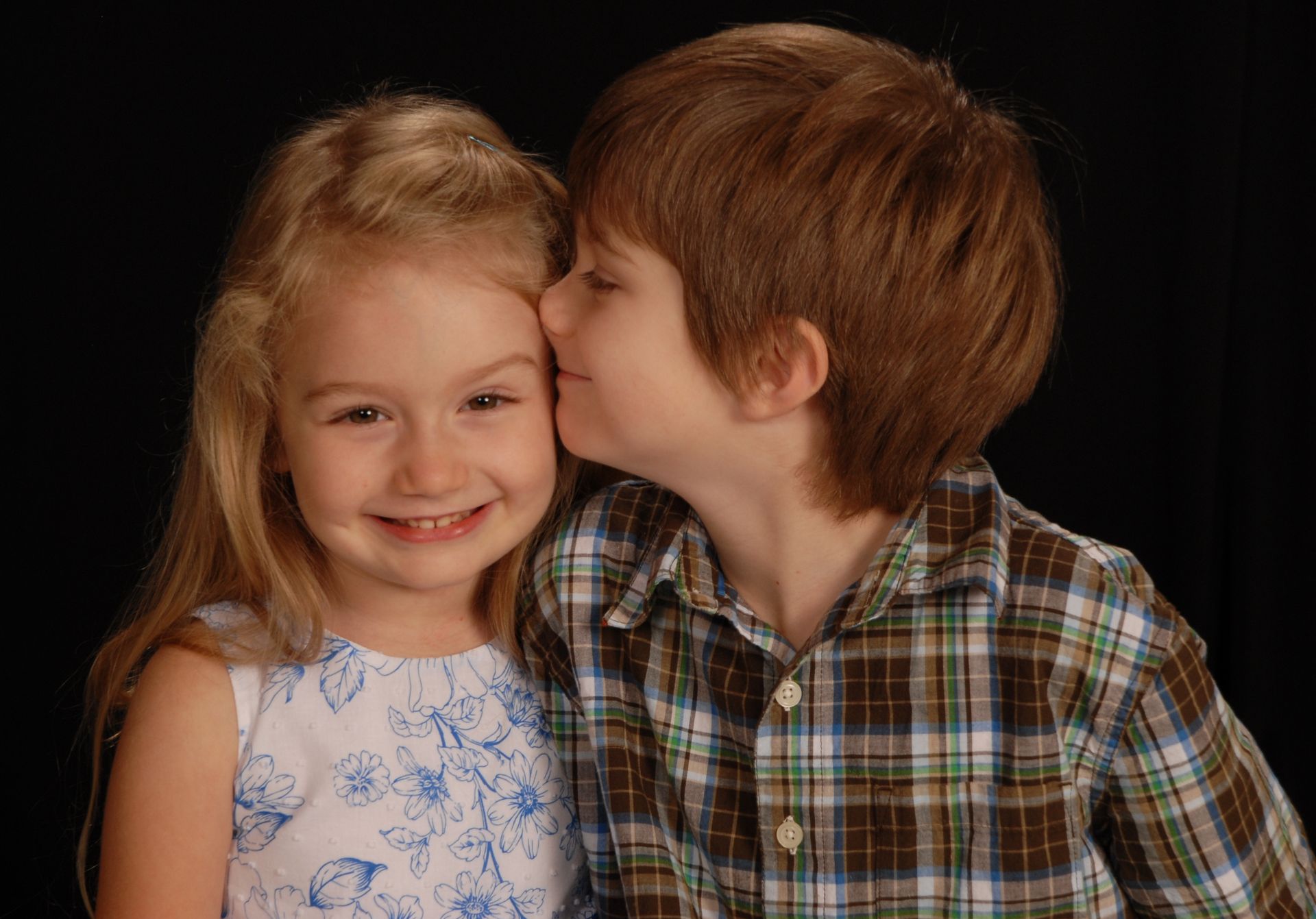 a person is walking two dogs on a leash on a path