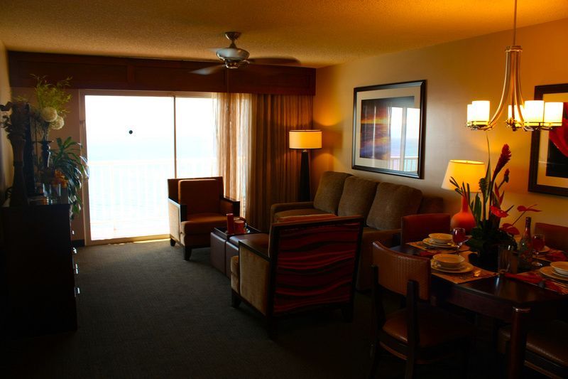 a living room with a couch a chair and a table