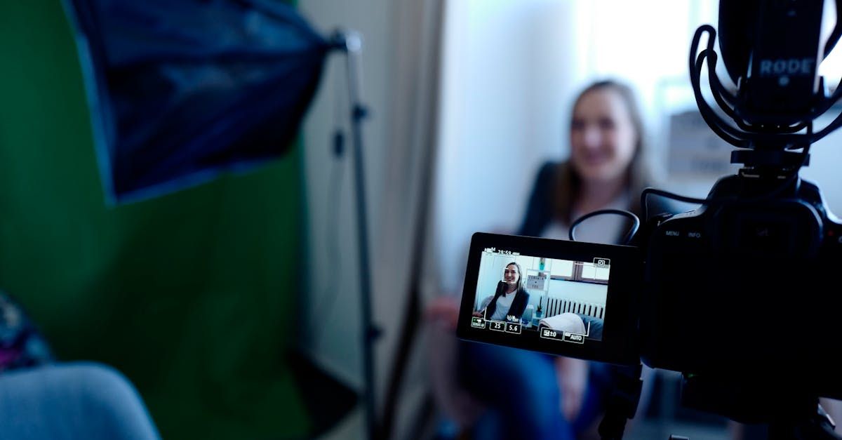 a man in a suit is talking to a woman in a blue dress