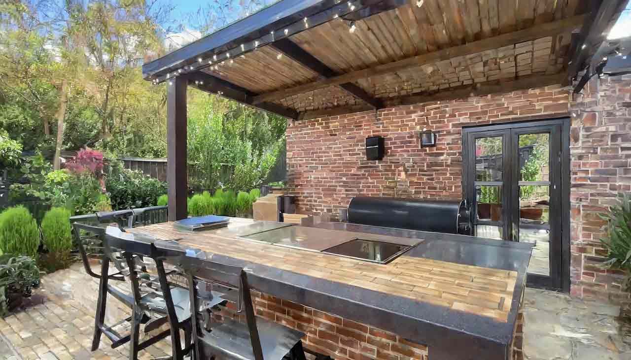 An outdoor kitchen image for Turf Plus blog