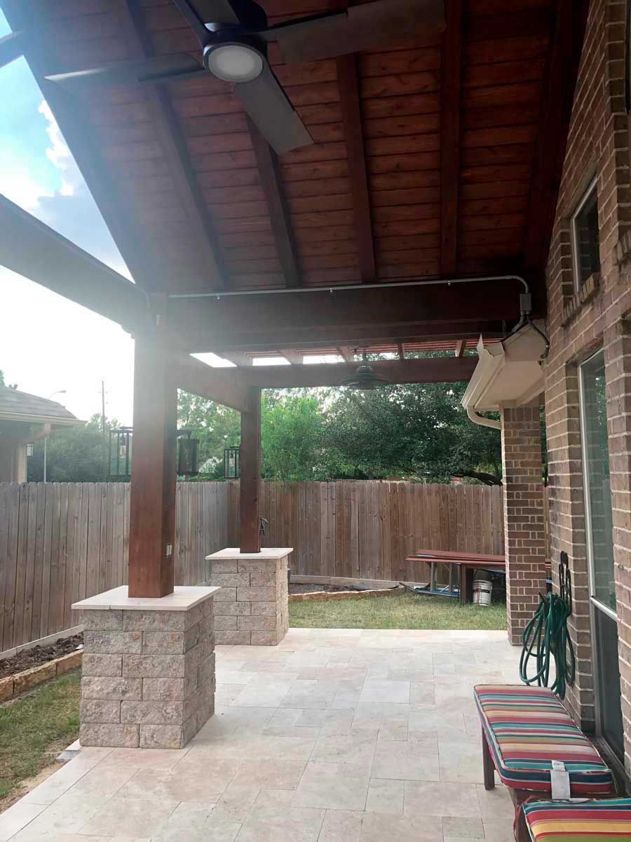 Cedar gable patio cover with a blade fan