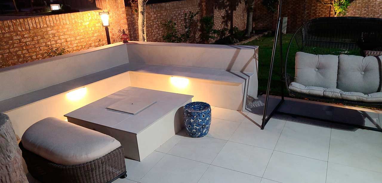 Modern space with porcelain tile fire pit for relaxation