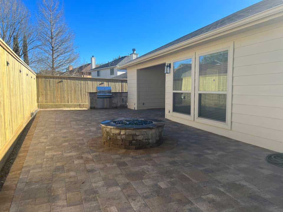 Large limestone patio with circular gel fire pit