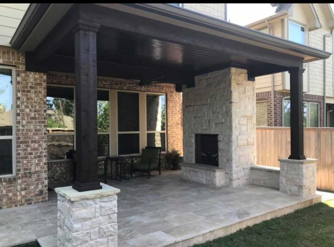 Small limestone patio covered in wood with the chimney