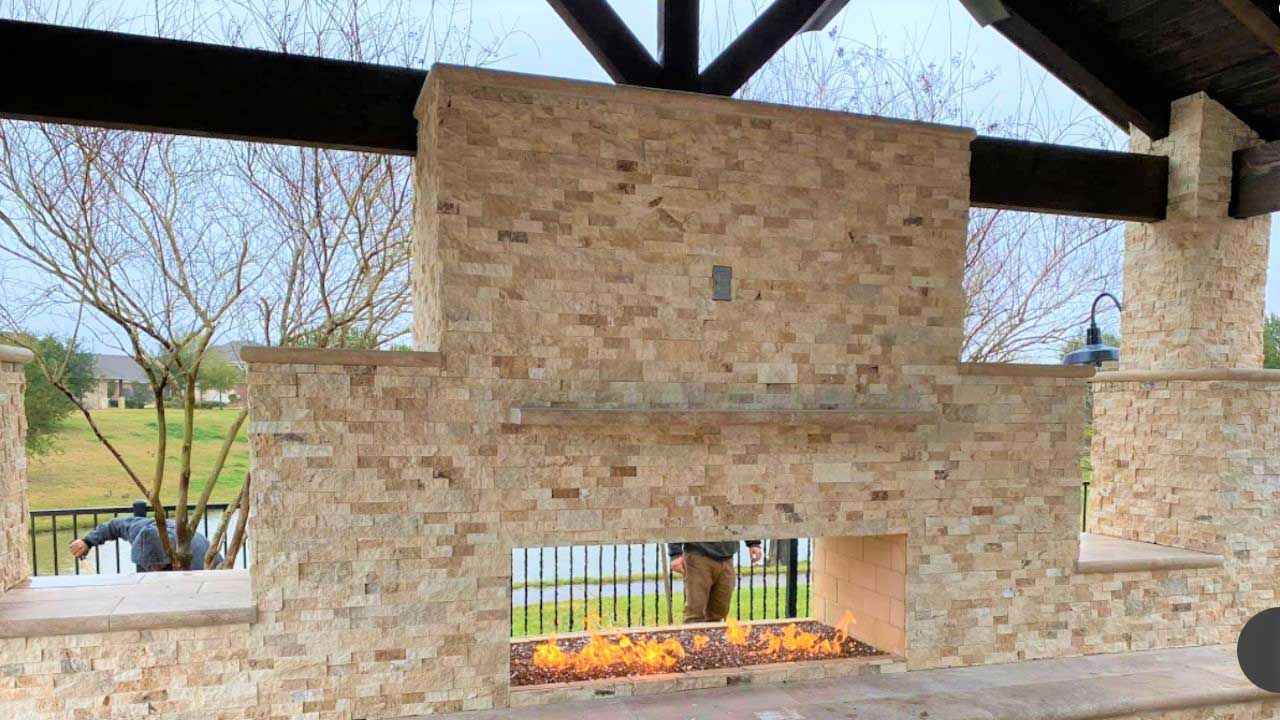 Large outdoor fireplace with modern light brick design
