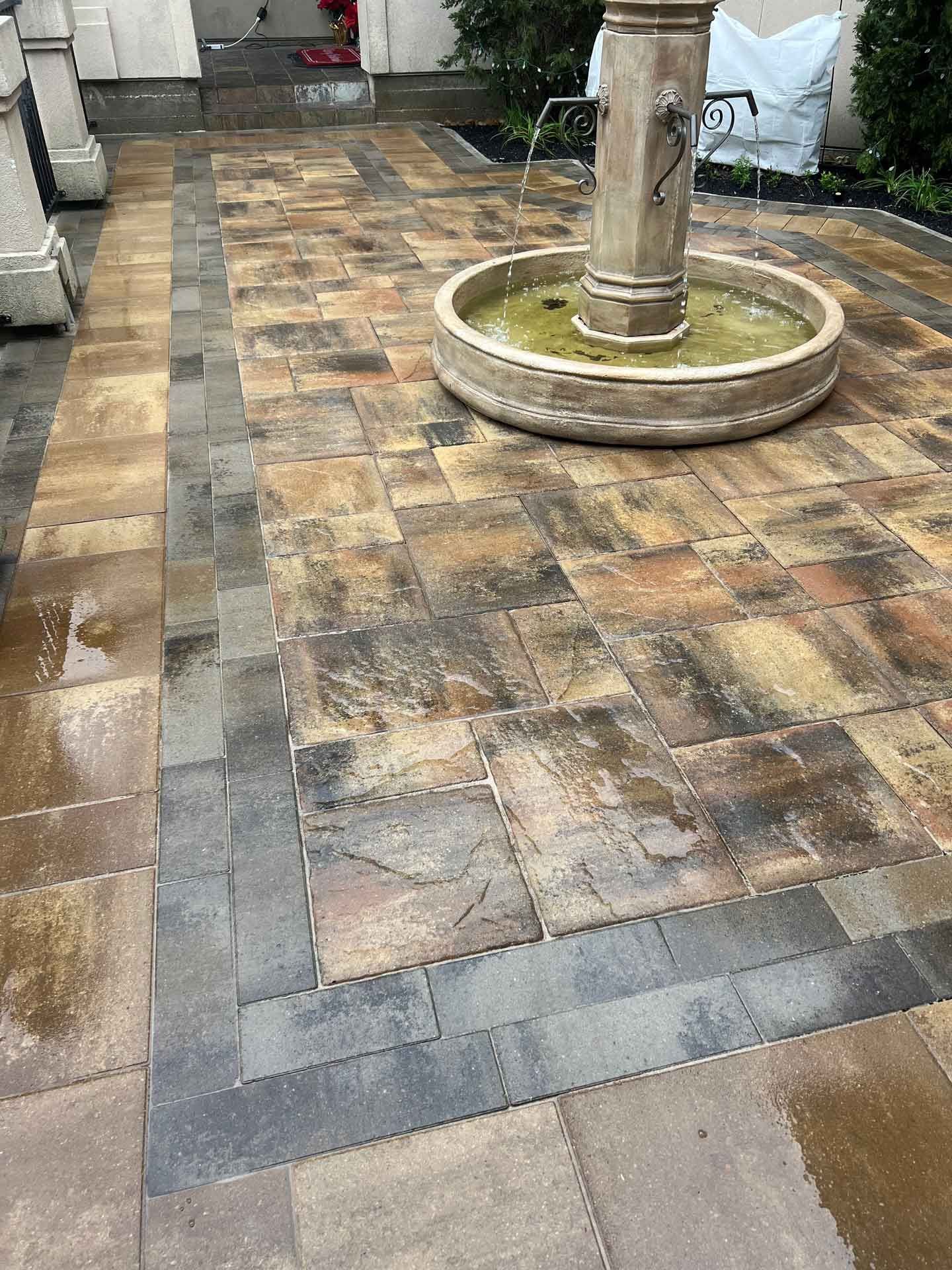 Shiny limestone patio with small fountain