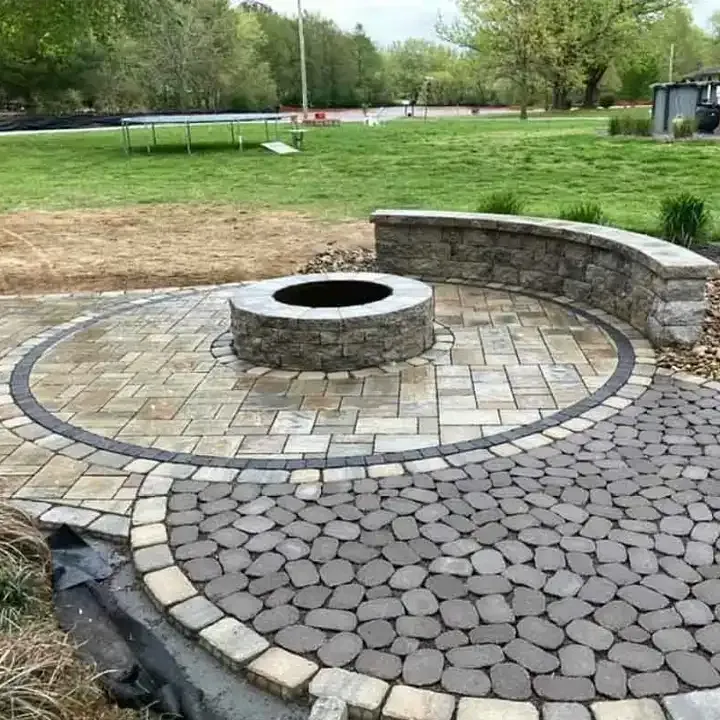 There is a fire pit in the middle of the patio.