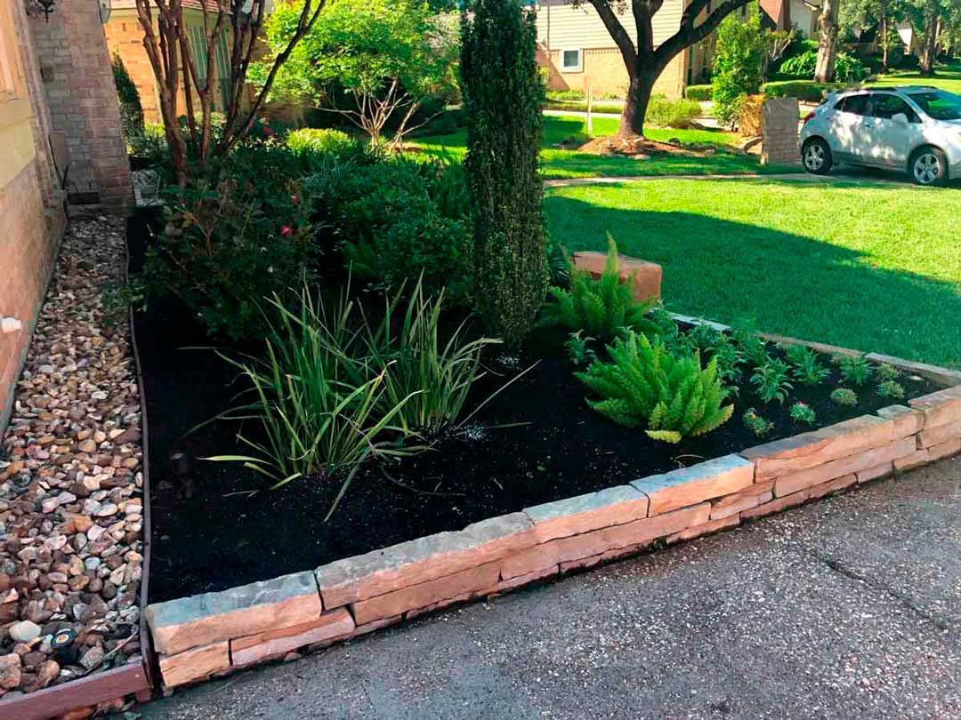 Landscaping bed with rock boundary