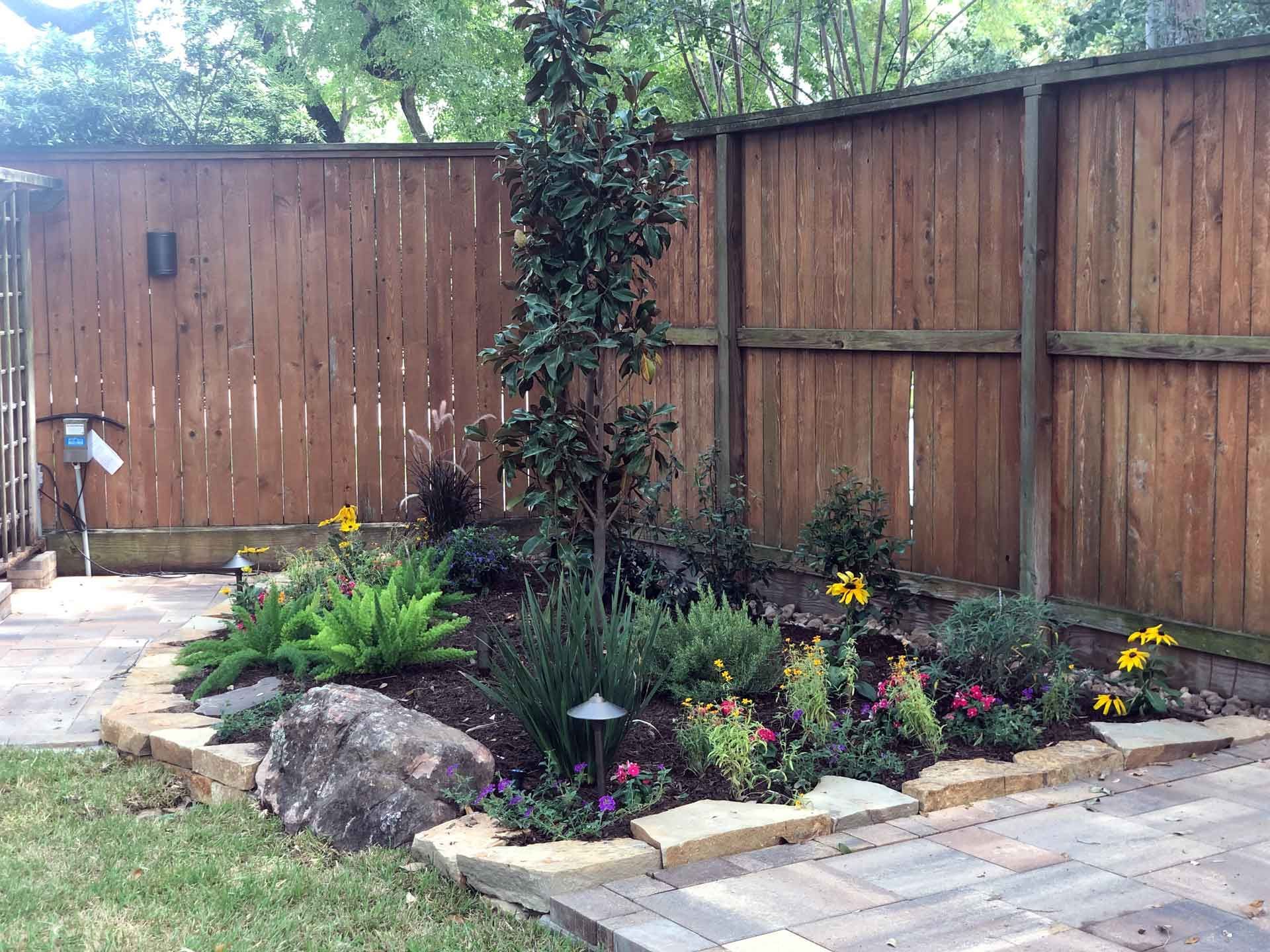 Nice small landscaping bed with plants and shrubbery