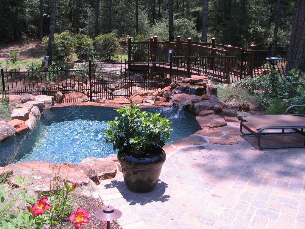 Pool deck and landscaping created by an outdoor living contractor in cypress