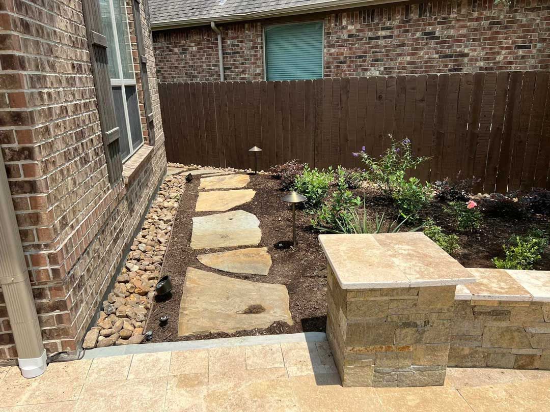 Small single-row stone path with landscaping bed