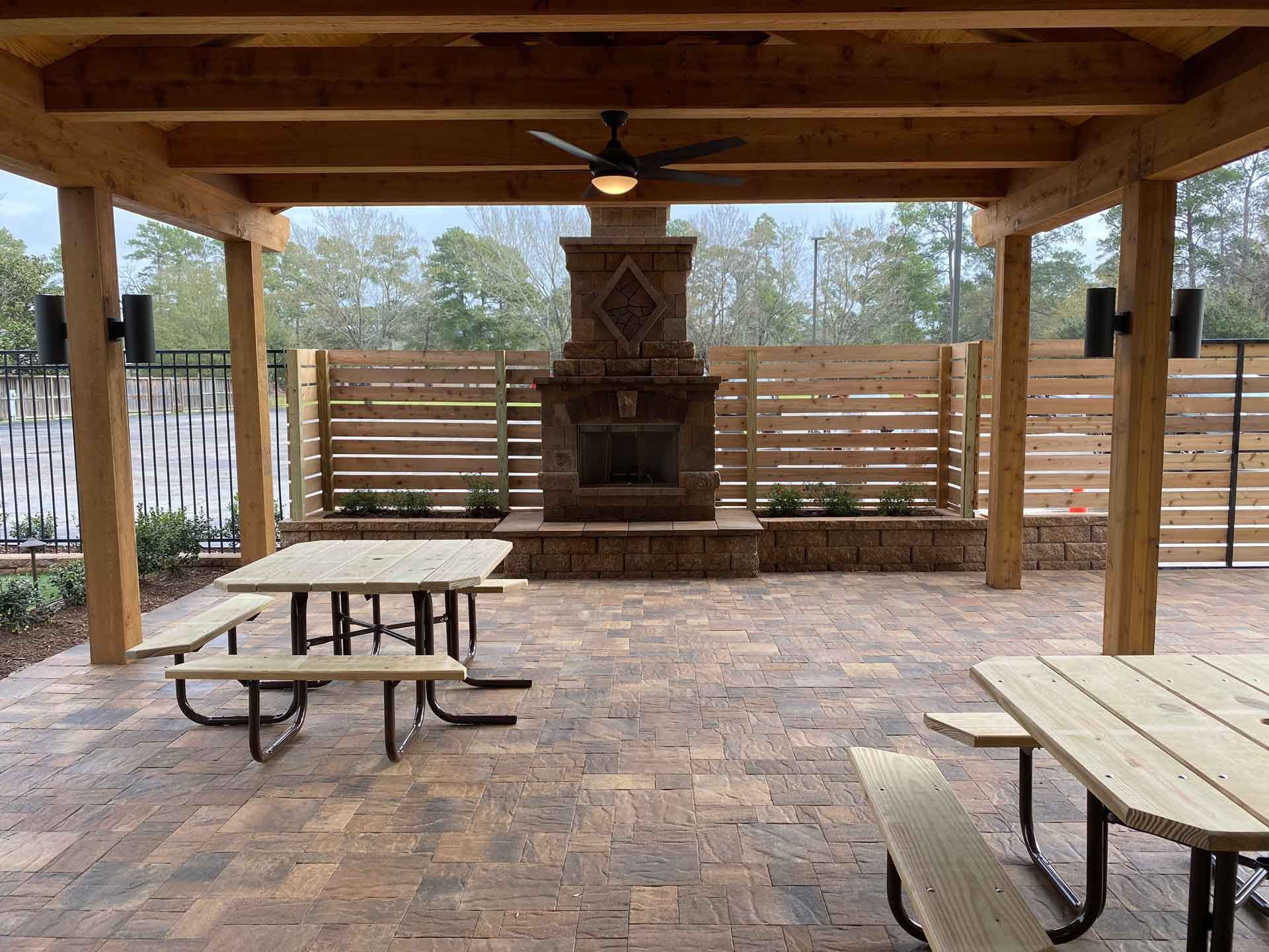 Limestone patio covered in wood with fireplace