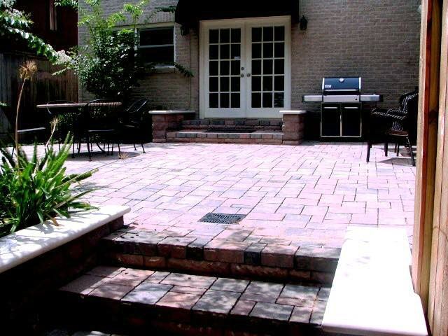 Red brick outdoor patio with staircase