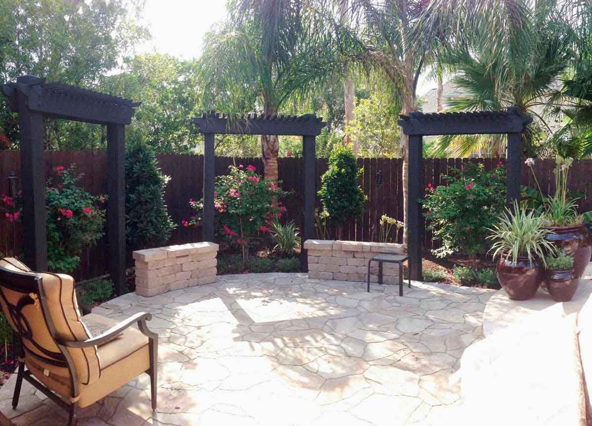 A beautiful circular outdoor patio made of stone with Chinese-style pergolas